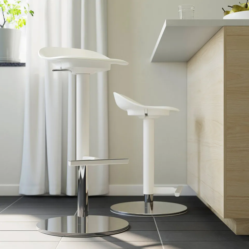 Adjustable bar stools with chrome bases near counter