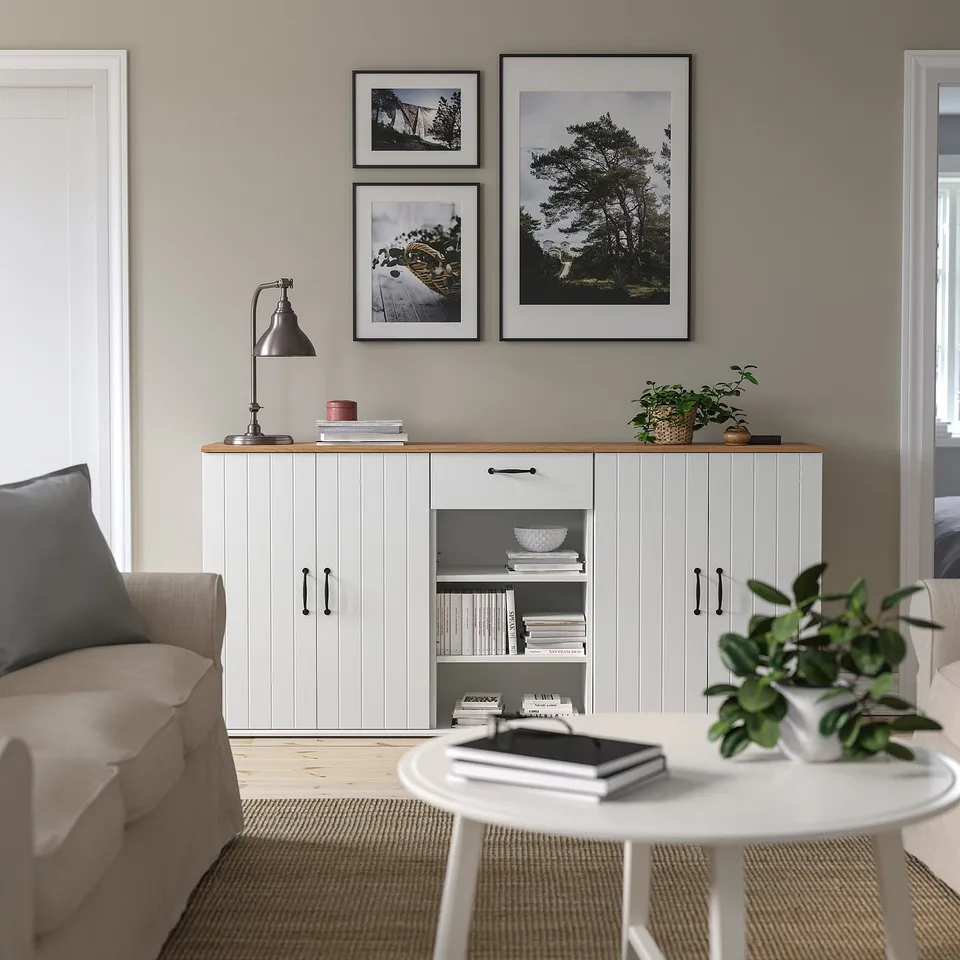Modern living room with SKRUVBY furniture, plants, and beige sofa.