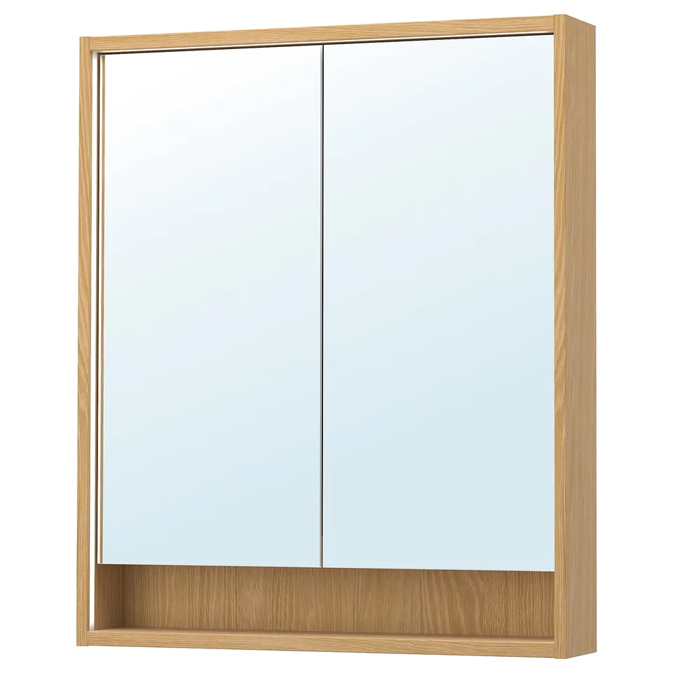 A FAXÄLVEN mirror cabinet with a light wood frame, featuring sliding mirrored doors and integrated lighting.