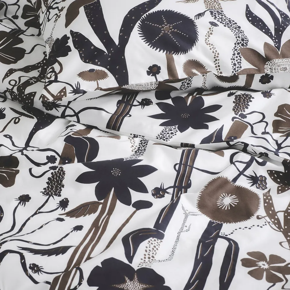 Exotic floral duvet cover with intricate, wild patterns. Crisp, durable cotton and lyocell blend offers breathable comfort.
