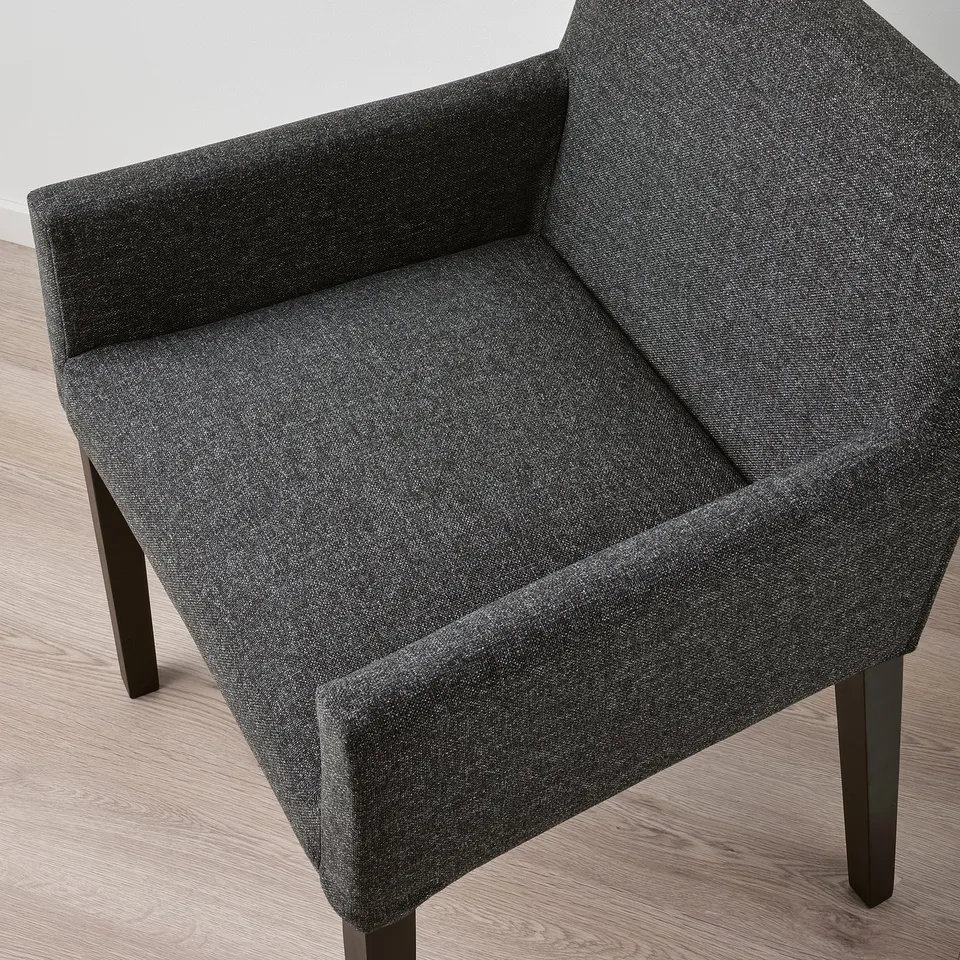 Modern grey upholstered chair with sleek design, padded seat and dark wooden legs. Elegant and comfortable.