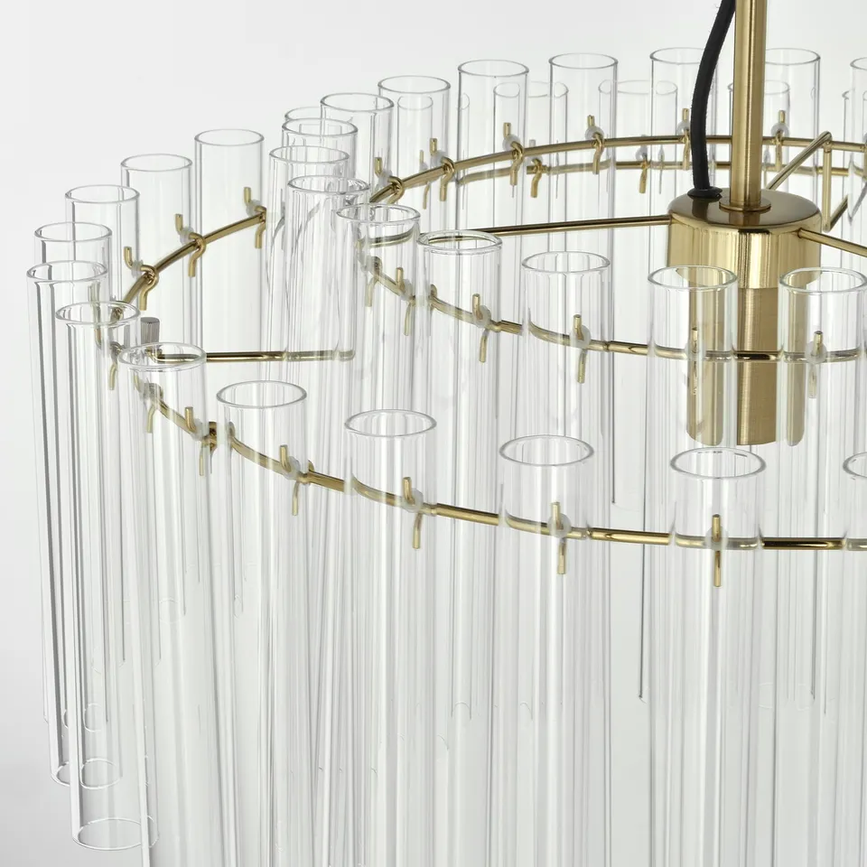 Elegant chandelier with clear glass tubes and gold metal hooks. Sophisticated design; high-quality materials.