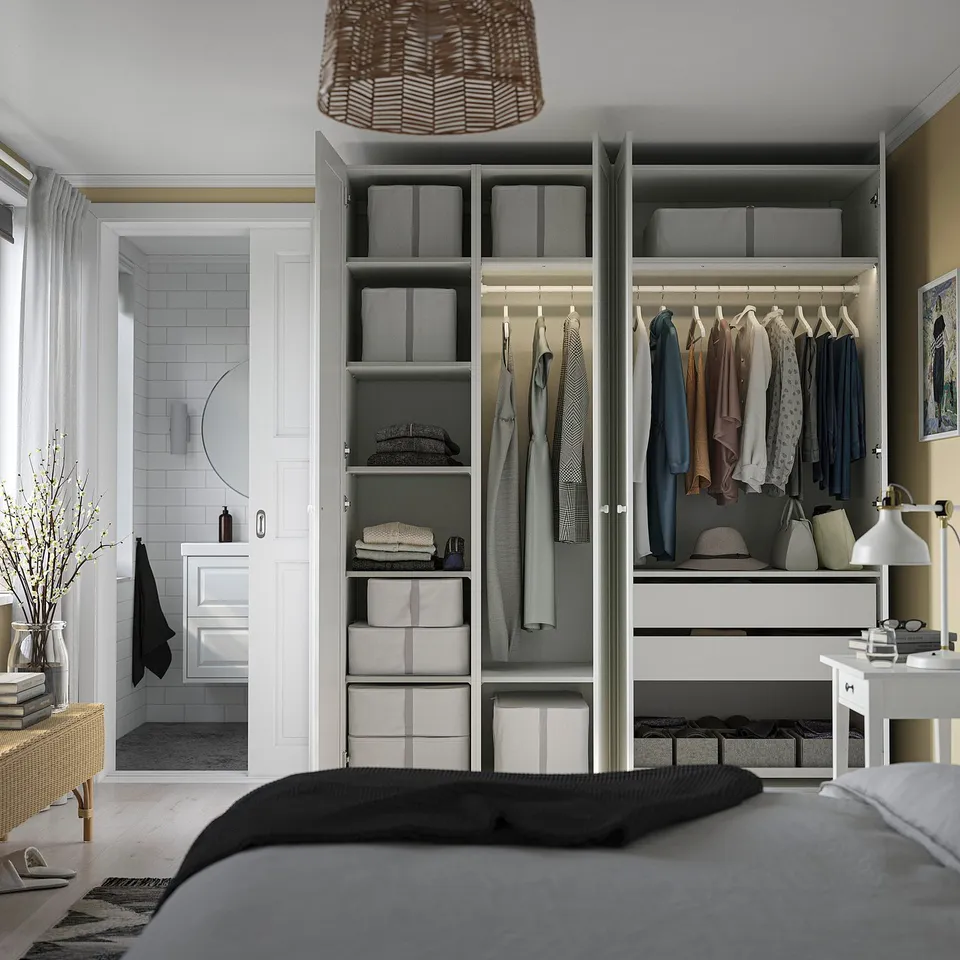Organised closet with shelves, hanging rods, and neat storage. Adjacent bathroom visible.