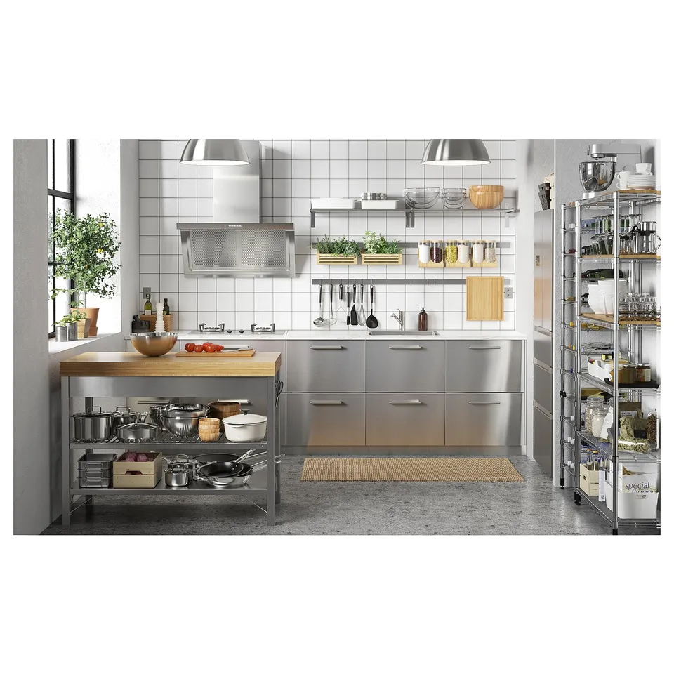Modern kitchen with stainless steel cabinets, bamboo countertop island, open shelving, and utensil rack.