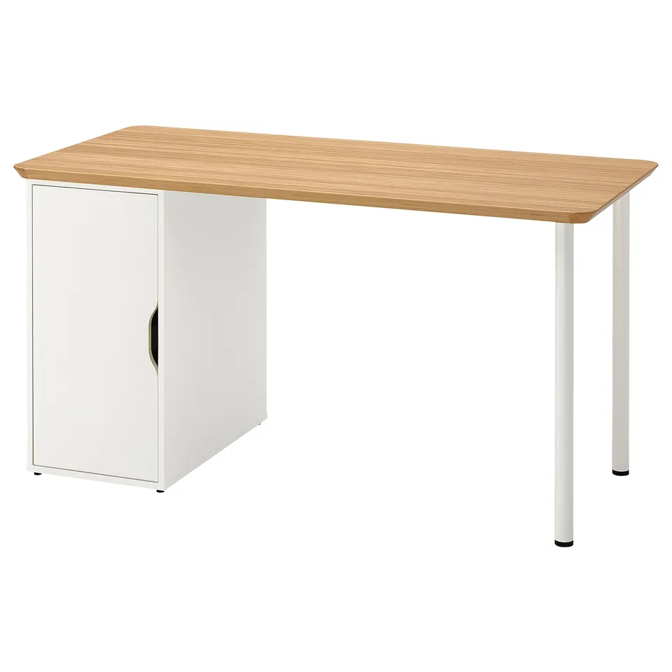 An ANFALLARE desk in light wood colour with a built-in cabinet. It has four metal legs and a white cabinet with one door.
