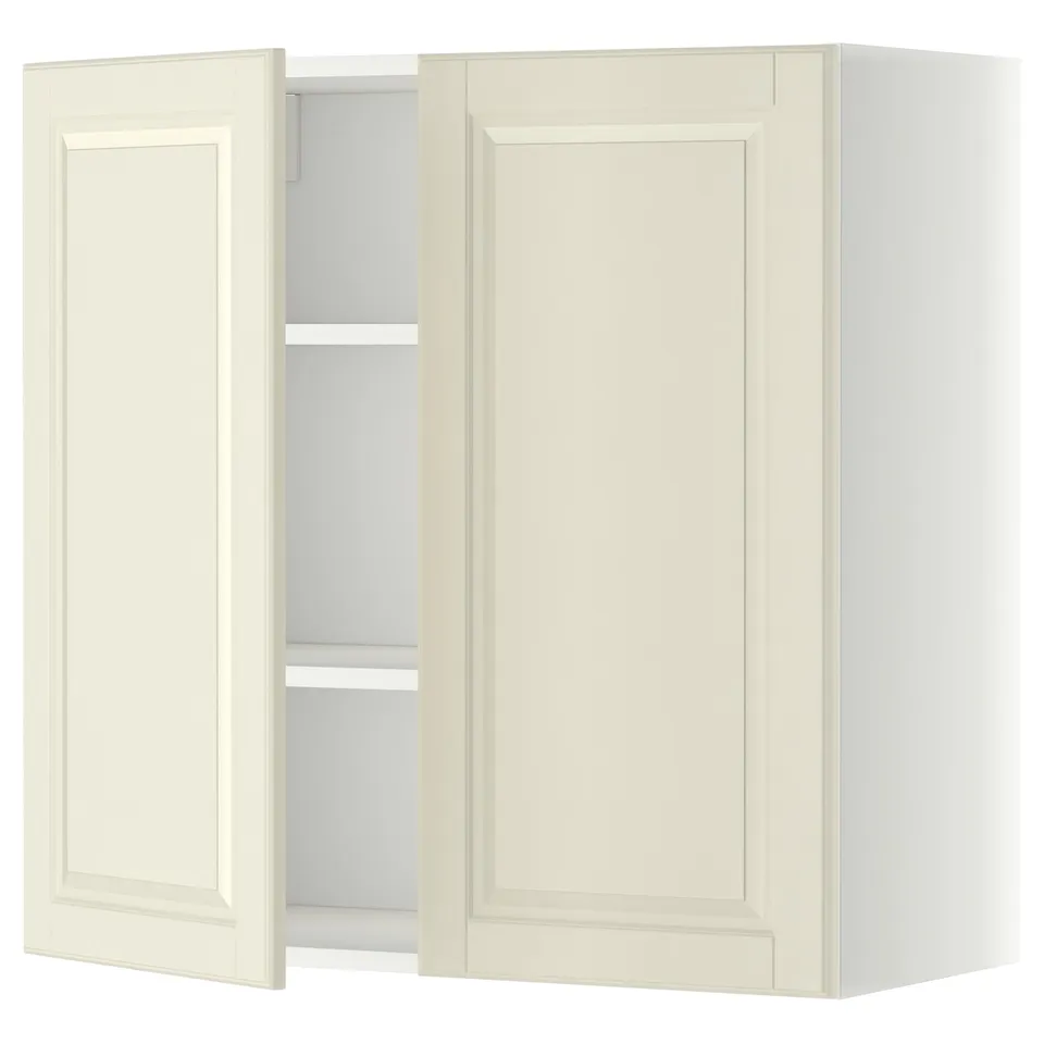 A white METOD kitchen wall cabinet with two doors open, revealing adjustable shelves inside.