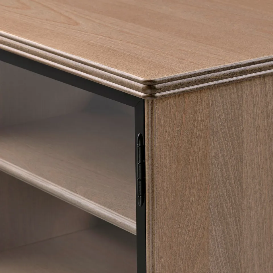 A wooden cabinet with a sleek, light finish and black hinges, showcasing quality craftsmanship.
