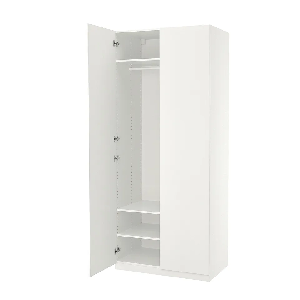 An open white ikea PAX wardrobe with minimalist design, adjustable feet, internal shelves, and soft close hinges.