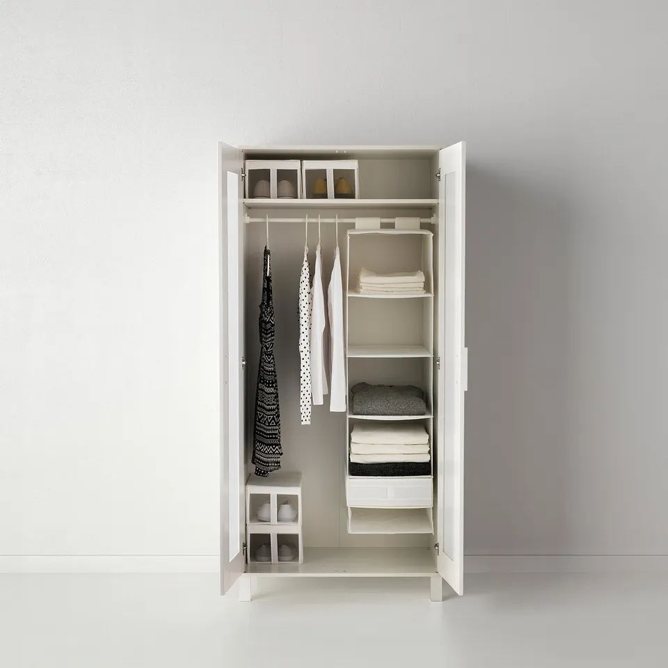 White wardrobe with SKUBB organisers, ideal for storing clothes, socks, and accessories.