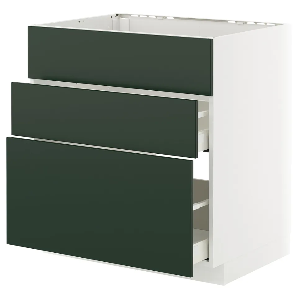 Modern kitchen cabinet with three green drawers; sleek, minimalist design.