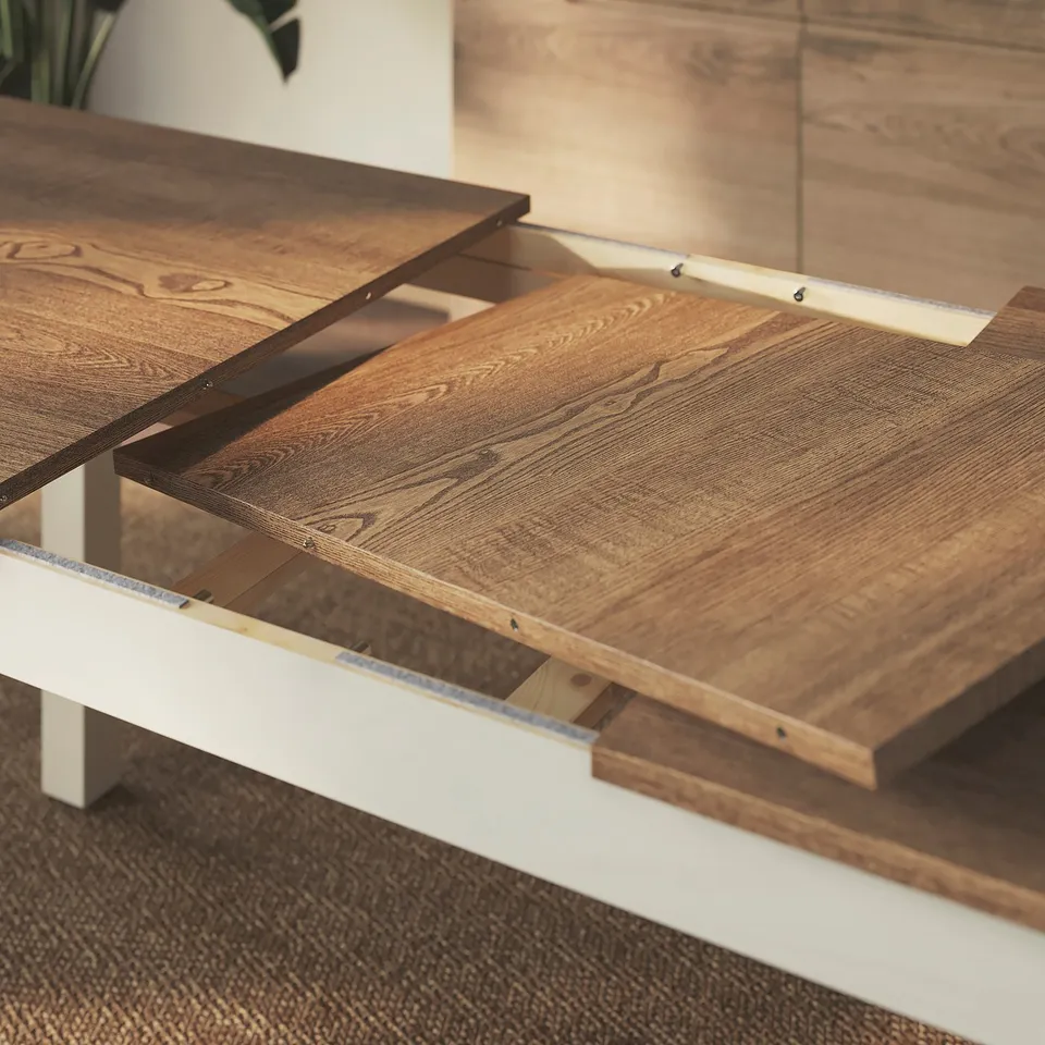 Extendable wooden dining table with metal legs, shown partially extended.