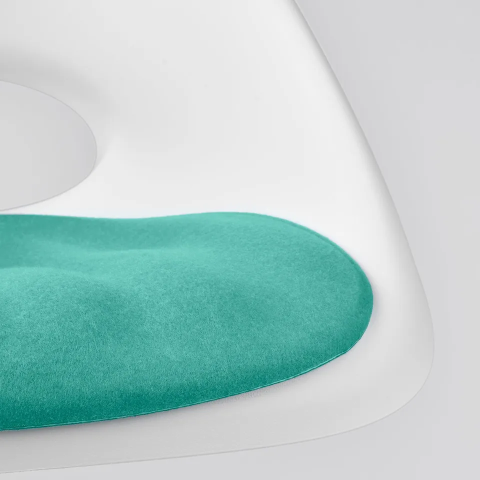 Modern white desk chair with teal cushion, offering comfort and support.