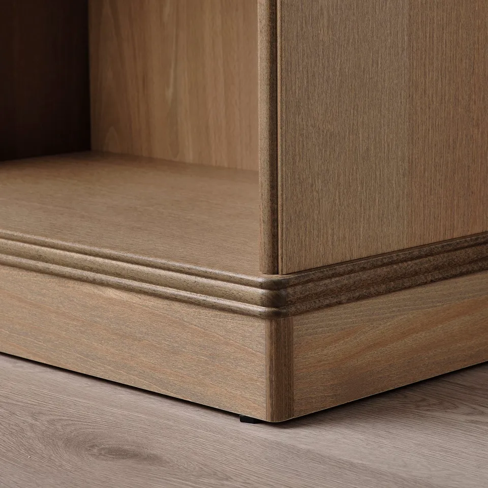Close-up of sturdy, well-crafted wooden bookcase corner, showcasing quality design and construction.