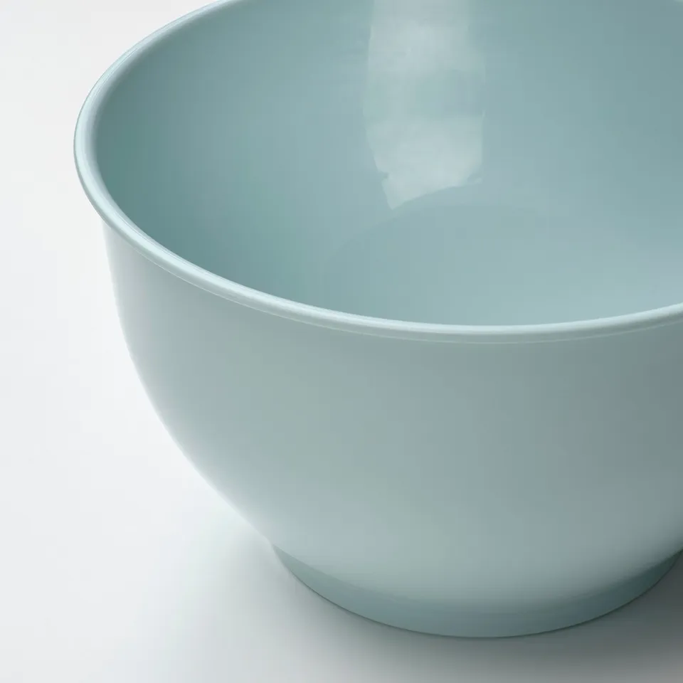 A large, pastel blue bowl made of smooth polypropylene plastic, showcasing its clean, modern design.