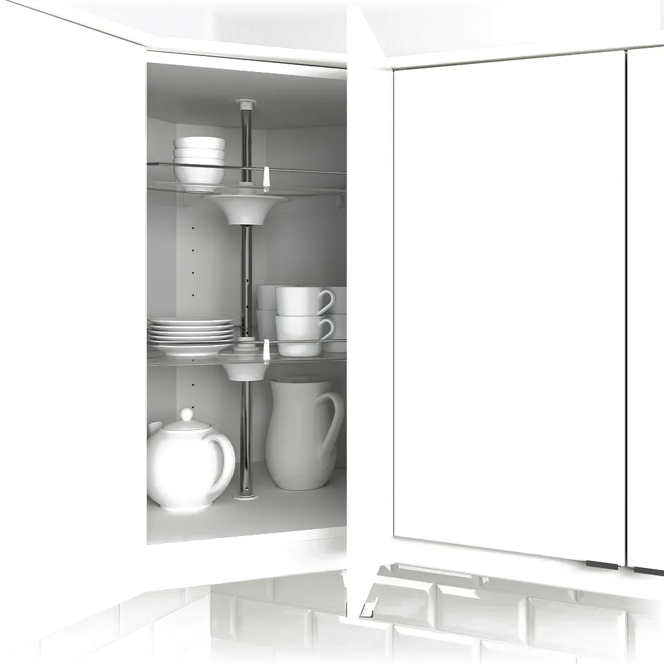 Open kitchen cabinet showing adjustable shelves with white dishes, cups, and a tea kettle.