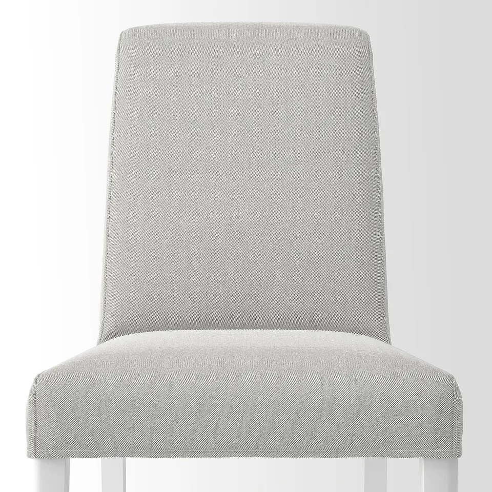 Modern upholstered chair with plush, breathable fabric, offering comfort and easy cleaning. Tailored backrest, lumbar support, and sturdy wooden legs.