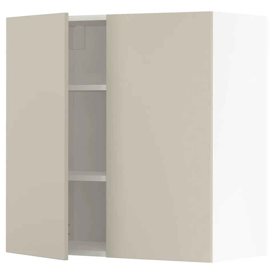 A beige METOD wall cabinet with one open door revealing an adjustable shelf inside.