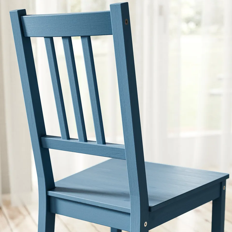 Blue wooden chair with vertical slats, shown from the side. Quality finish, sturdy design.