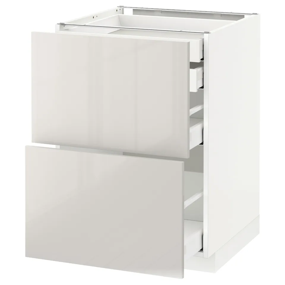 White METOD kitchen cabinet with glossy drawers.