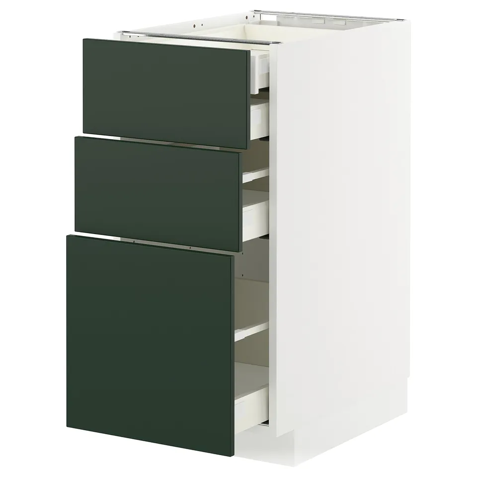 Three-drawer white base cabinet with dark green drawer fronts.