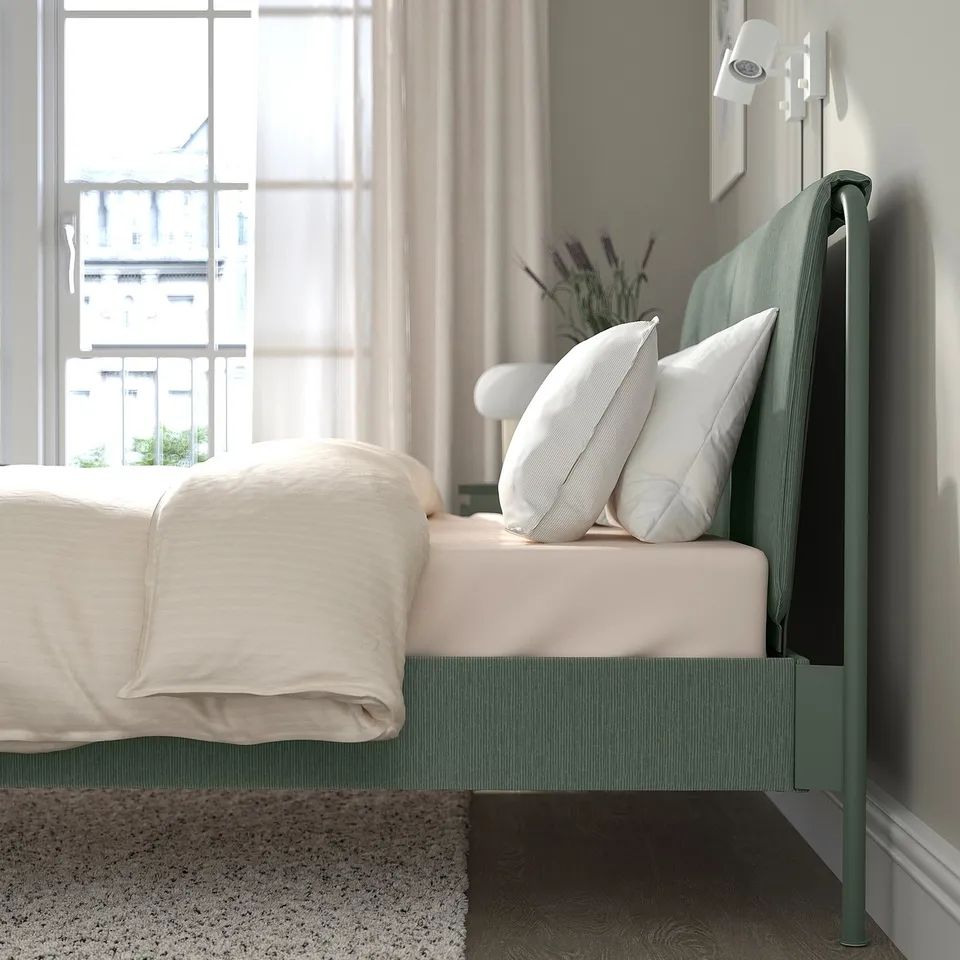Modern green metal bed frame with headboard, clean lines, and adjustable bed sides for varied mattress thicknesses.