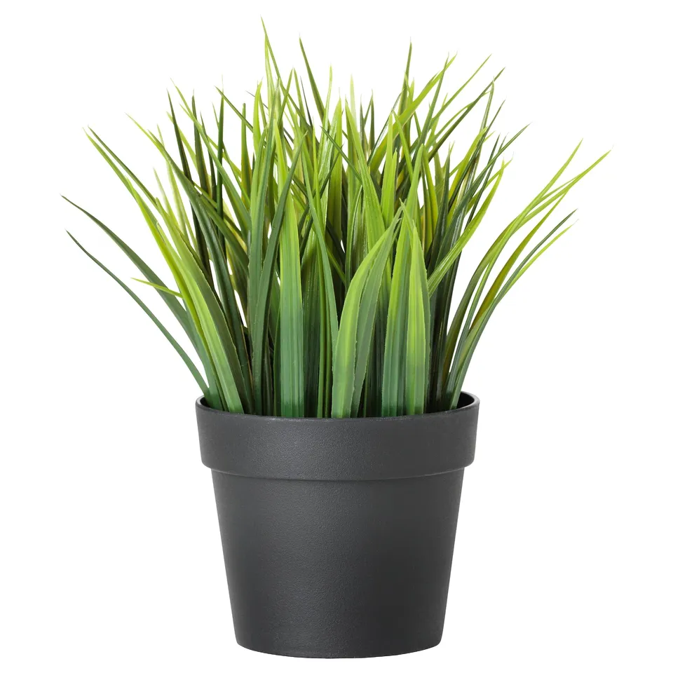 Grey artificial potted plant with green foliage.