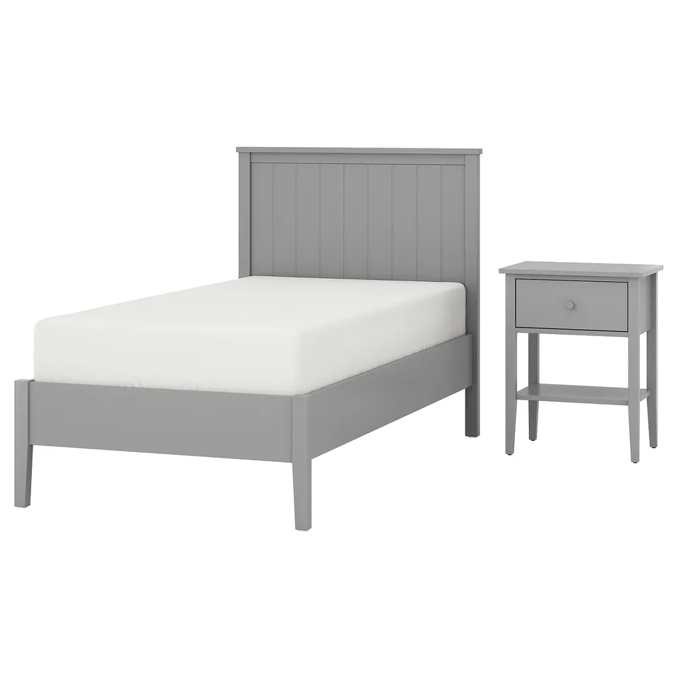 A grey GULLABERG twin bed set with matching bedside table. The pieces have a simple, modern design with a white mattress.