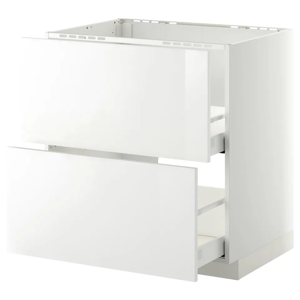 Displays a white METOD kitchen cabinet. It a modern design with high-gloss, clean lines, and a built-in compartment for an oven or sink.