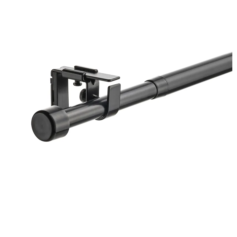 A BEKRÄFTA curtain rod set, black, with a sleek, modern design featuring metal materials and plastic accents, ideal for mid-century modern decor.