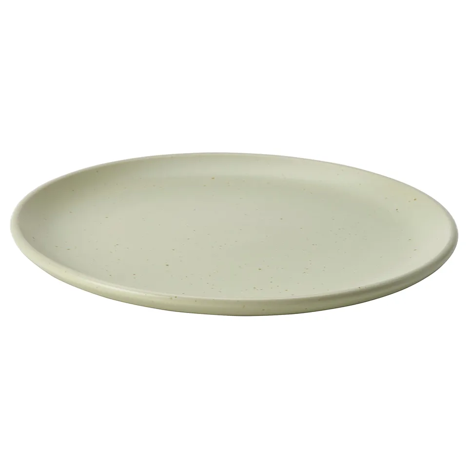 Light green round ceramic plate with speckles.