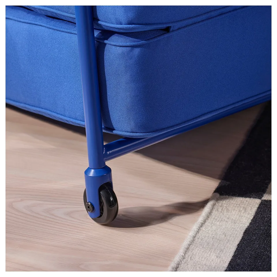A blue fabric chair with a steel frame and wheels, showcasing sturdy construction and comfy design.