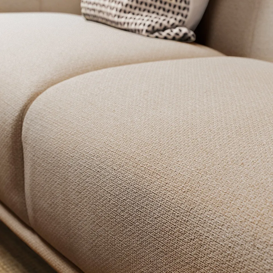 A cream-colored VISKAFORS sofa with rounded shapes and soft cushions, featuring a classic and inviting design.