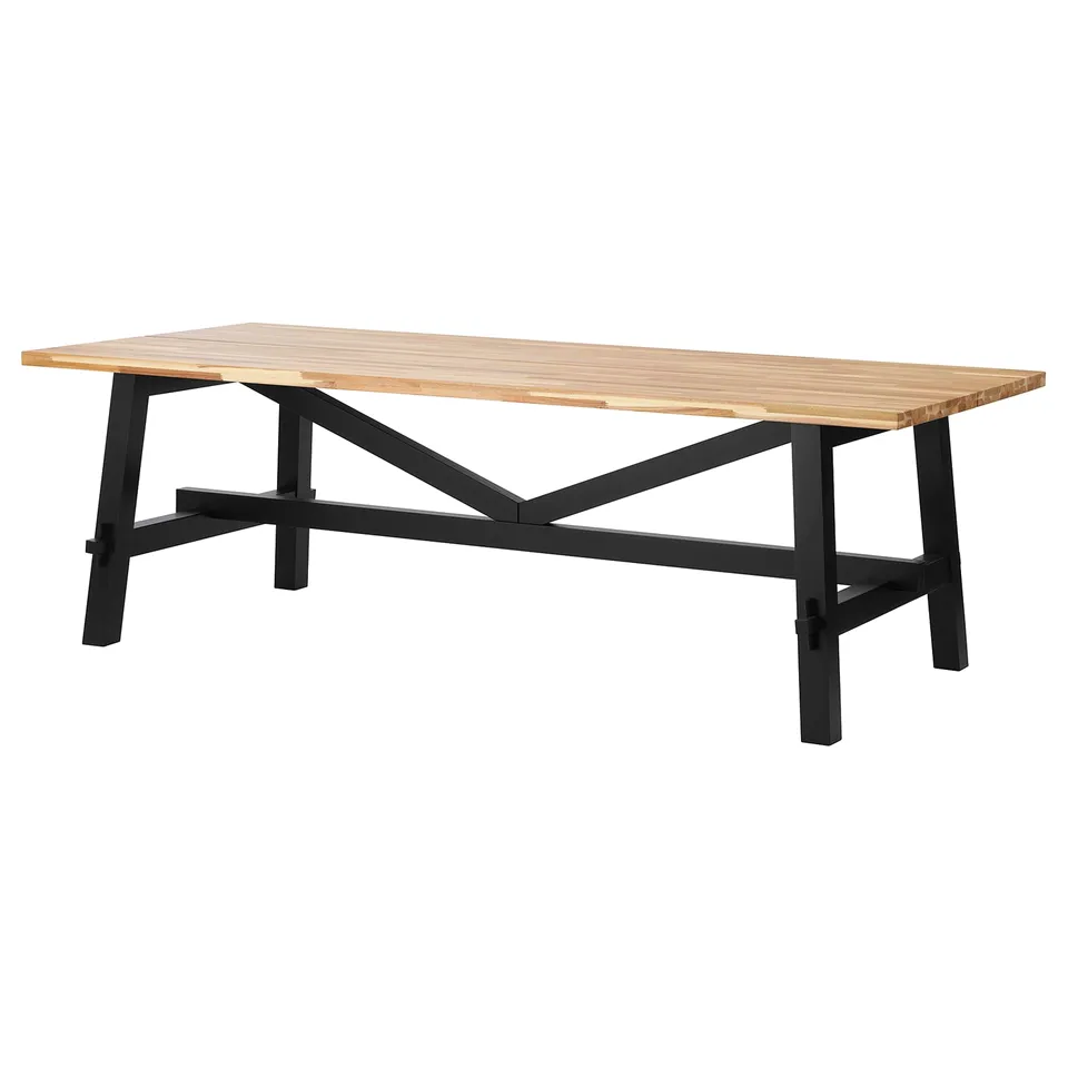 A SKOGSTA dining table with a light brown wooden top and black metal legs. Stylish and durable for heavy use.