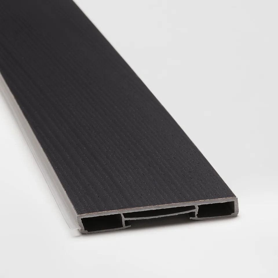 Black kitchen plinth with textured surface, bevelled edges, and metal connectors.