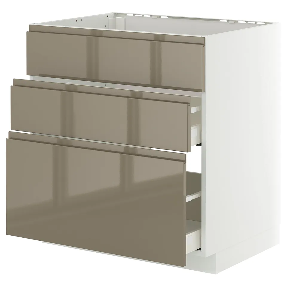 Modern kitchen unit with three metallic brown drawers, sleek design.