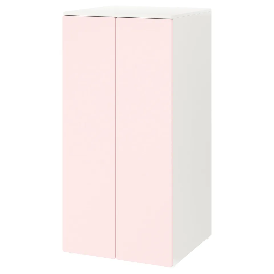 A SMÅSTAD storage cabinet in light pink with a rectangular shape and two doors.