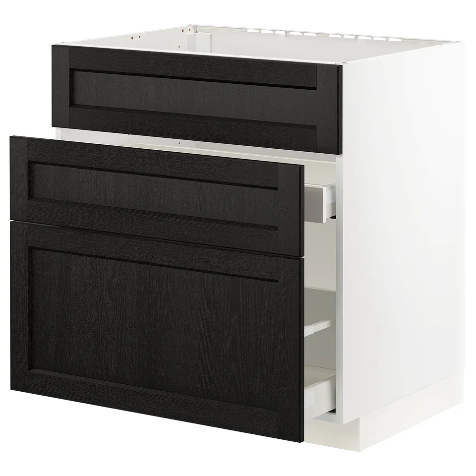 A black stained wooden drawer unit from the METOD kitchen system, featuring clean lines and bevelled edges, set against a white cabinet frame.