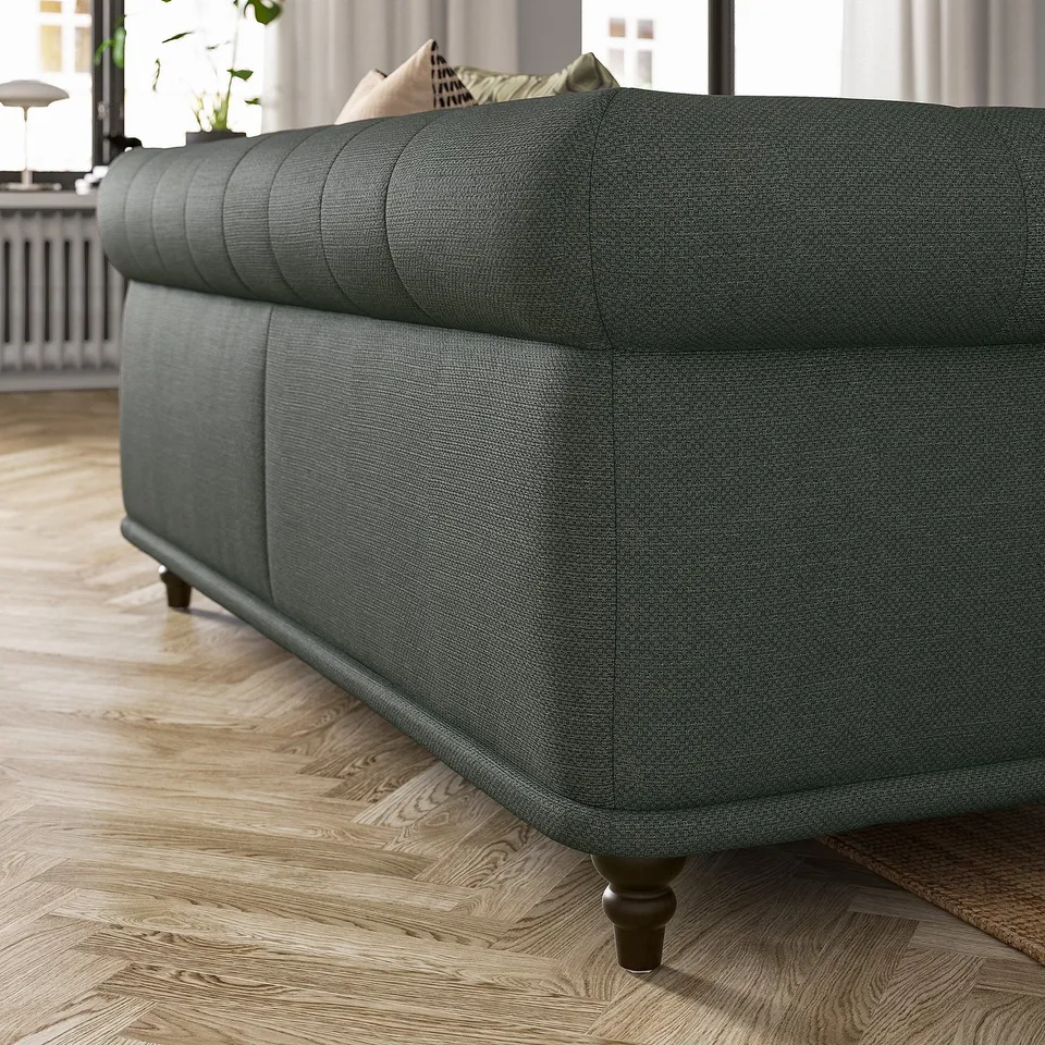 Dark grey VISKAFORS sofa; classic design with rounded shapes, shown from the side.