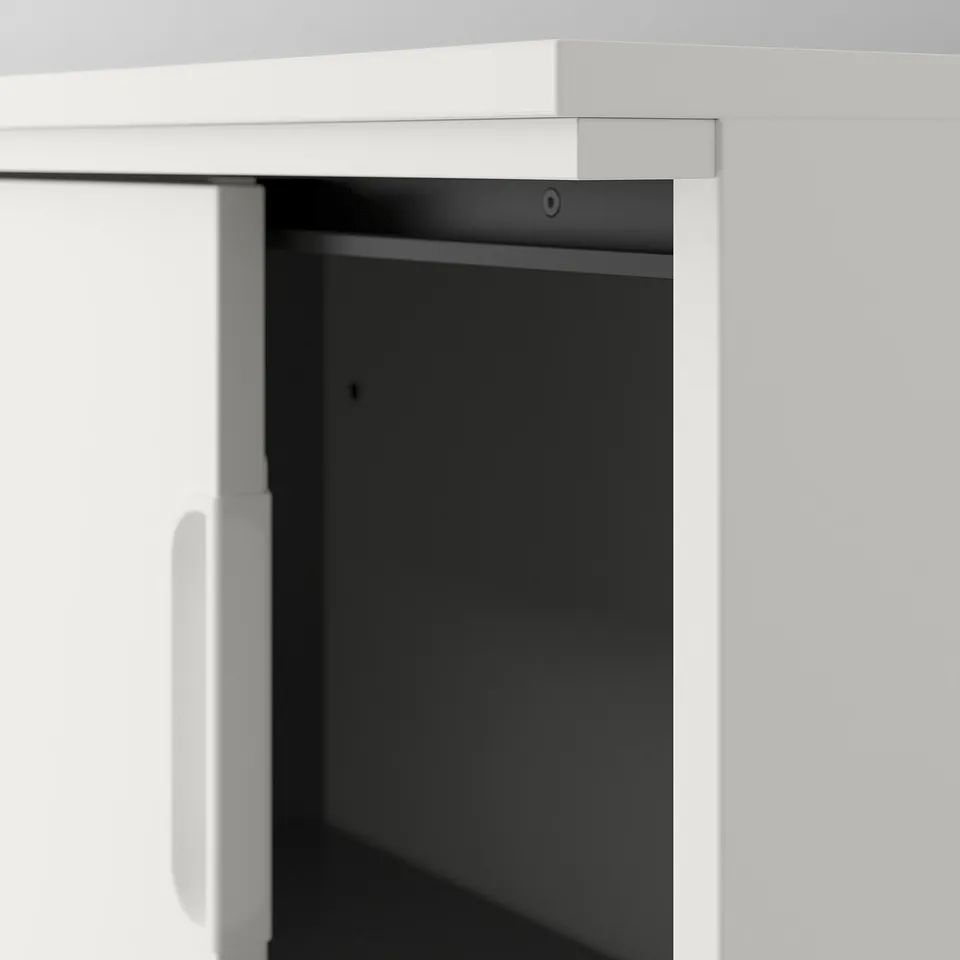 White GALANT storage unit with adjustable shelves, secure lock, and cord management system.