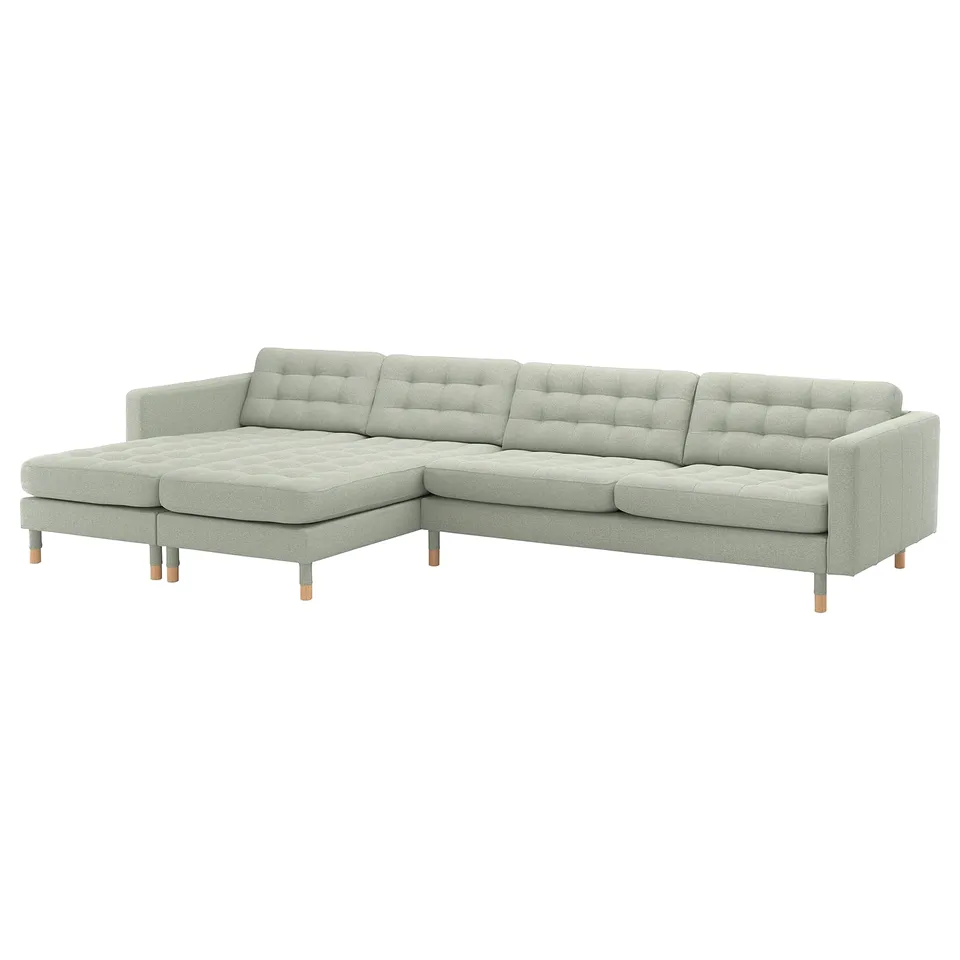 Modern light grey sectional sofa with wooden legs, tufted back, and cushions.