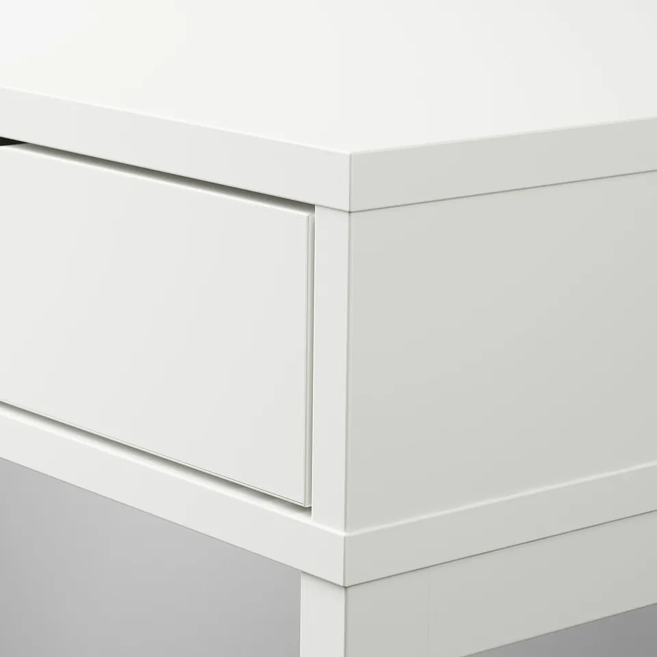 Minimalist white desk with sleek design and built-in drawers, showcasing high-quality materials and smooth surfaces.