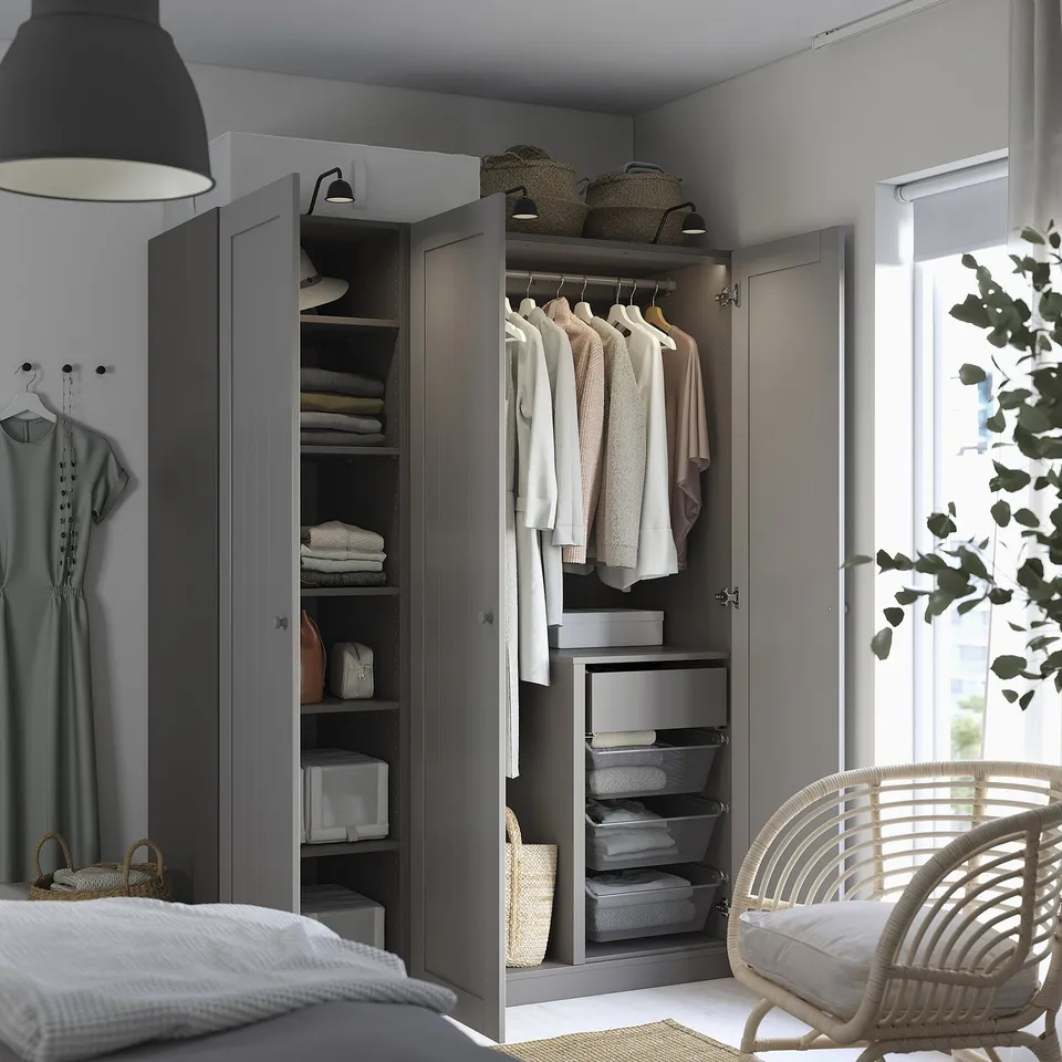 A well-organized wardrobe with foldable shelves and hanging space. Interior organisers and adjustable feet are visible.