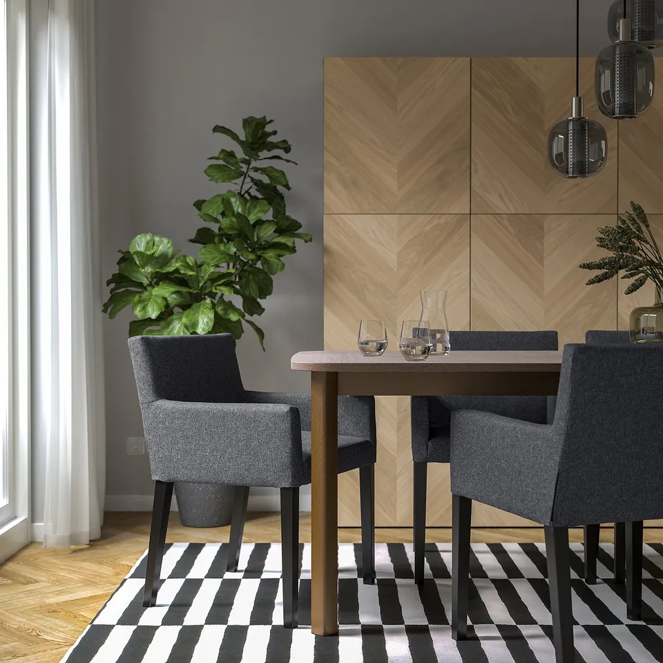 Modern dining setup with MÅRENÄS grey chair, cosy table, plants, and natural light.
