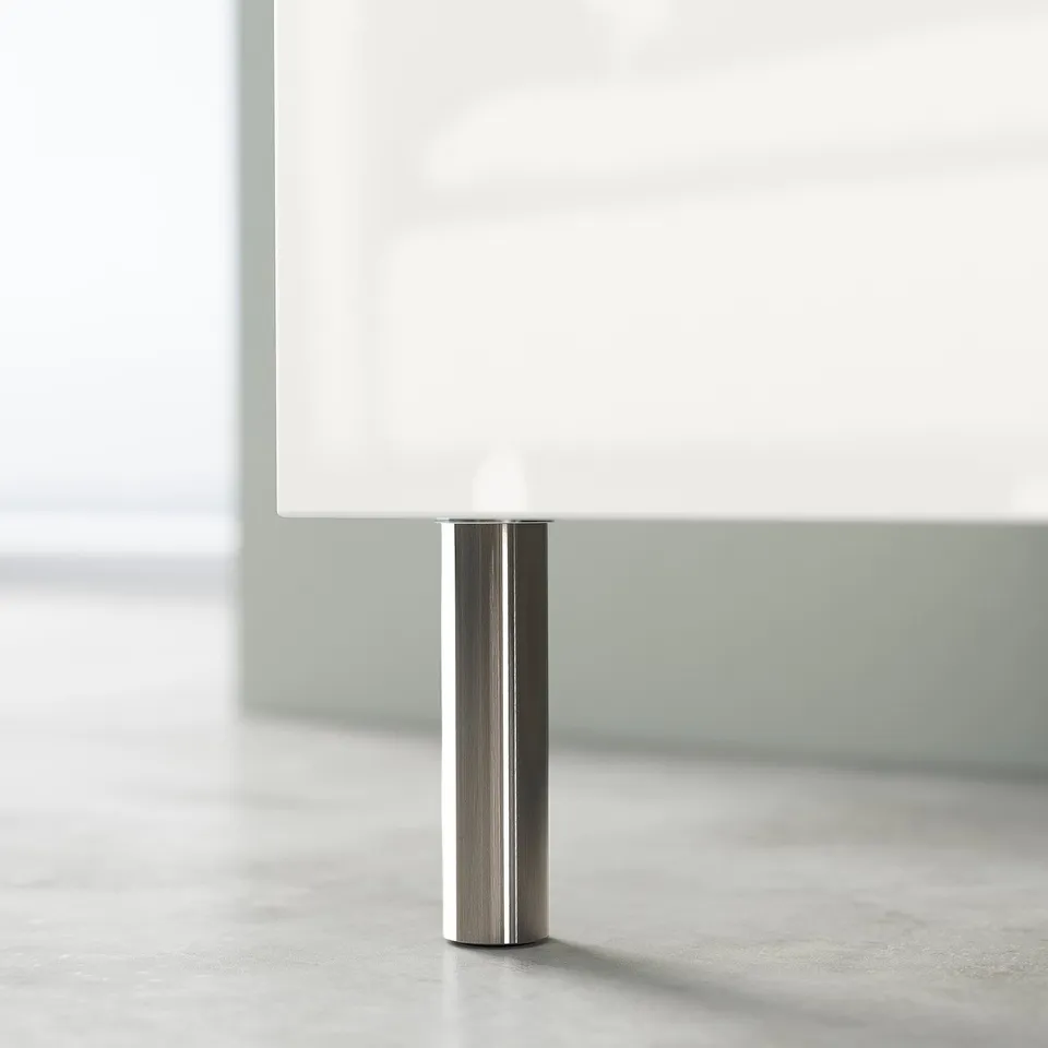 Modern white tv stand with steel leg, minimalist design.