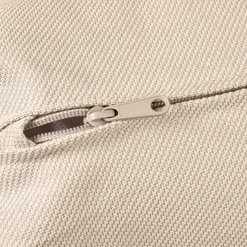 Zip on cream fabric sofa, smooth pull for easy use.
