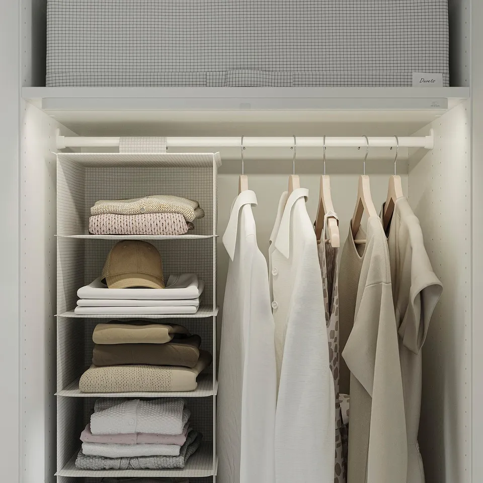 Closet with neatly folded clothes and hanging garments. Adjustable shelves and led lighting.