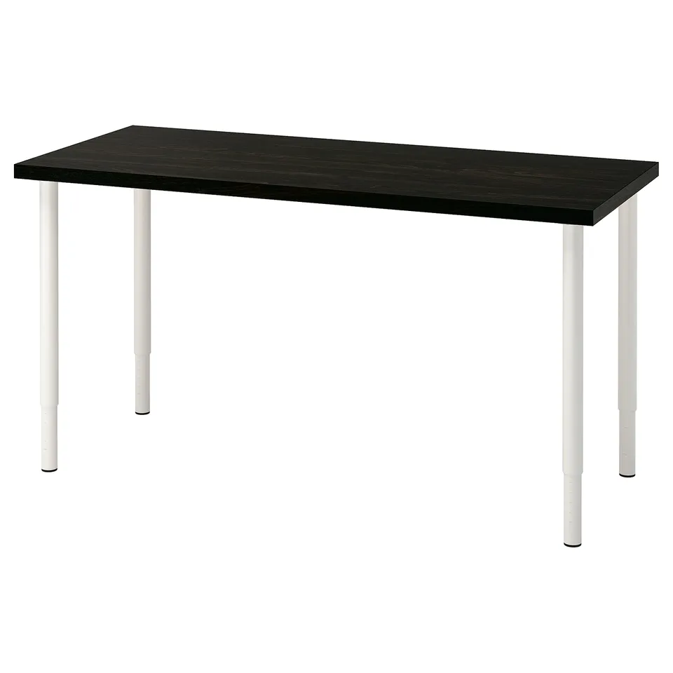 An IKEA LAGKAPTEN desk with a black table top and white adjustable legs.