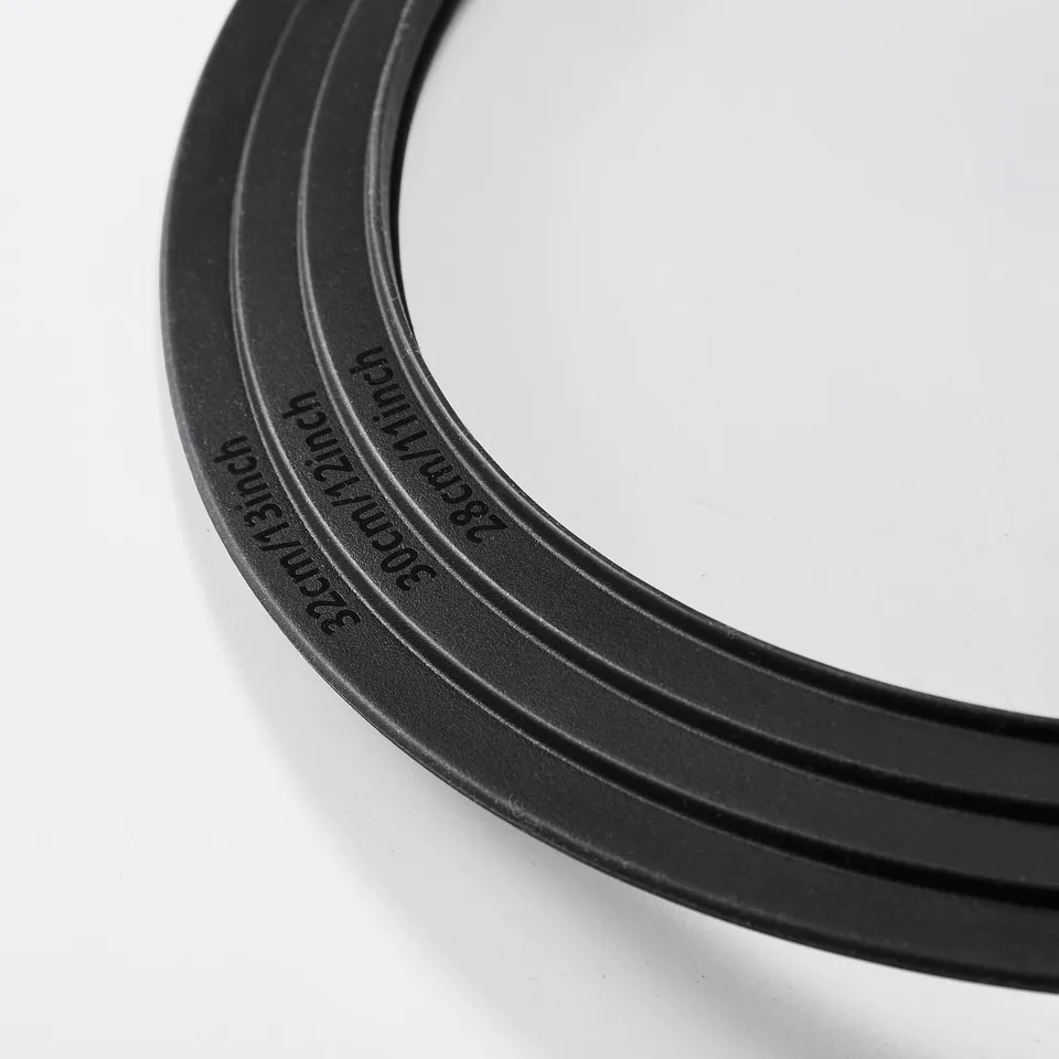 Black rubber band with embossed KLOCKREN text, neatly coiled, displayed on white background.