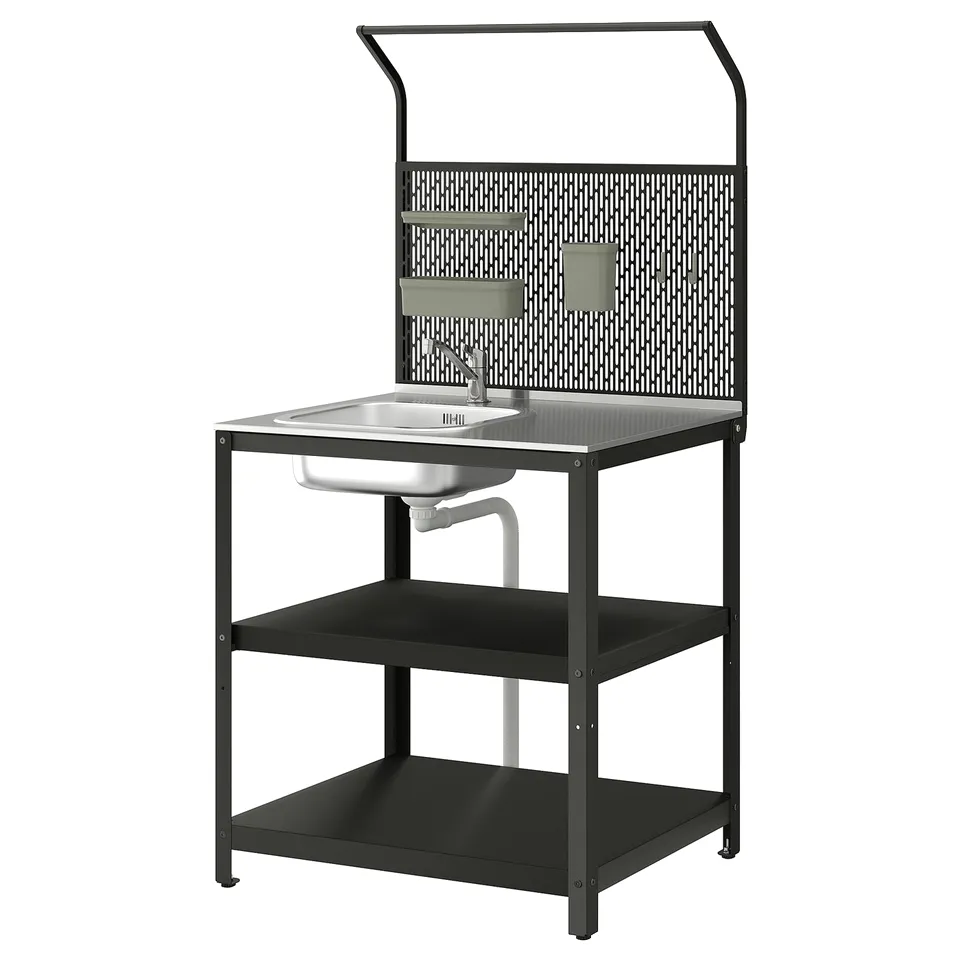 Modern black outdoor sink station with shelf, stainless steel bowl, and grey pegboard.