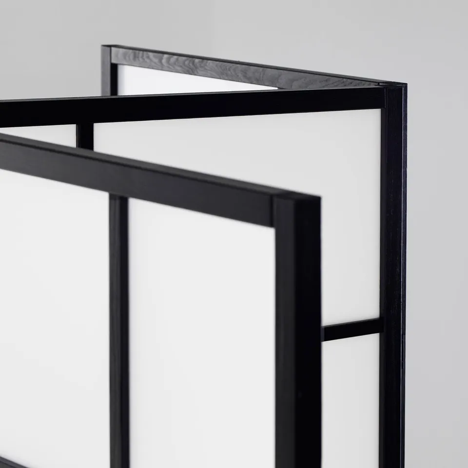 Black wooden room divider, folded neatly. Strong, sleek design with visible wood grain.